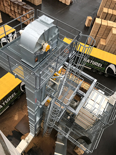 Bucket elevator - for vertical transport of saw dust in a pellet plant